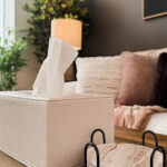 Therapyworthwhile therapy room details with a tissue box and coasters on a wooden table.