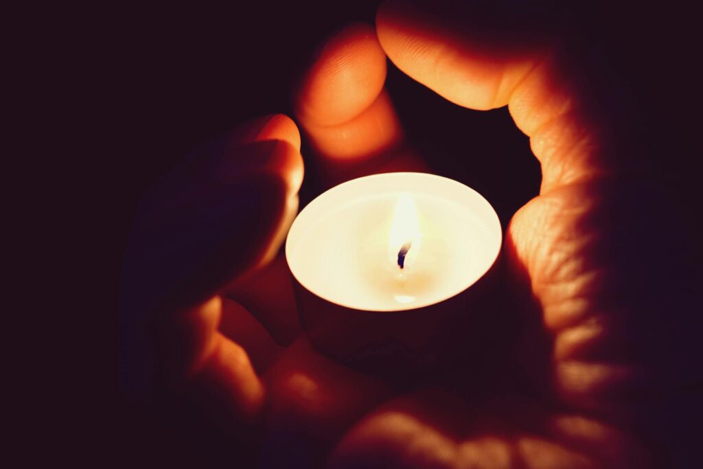 Tealight candled in palms of cradled hands, therapyworthwhile